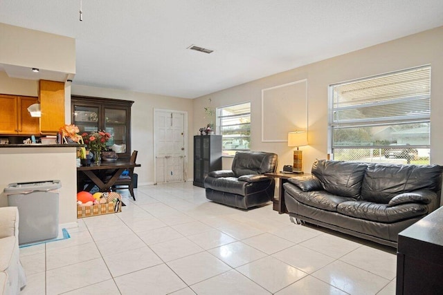 living room with light tile patterned floors