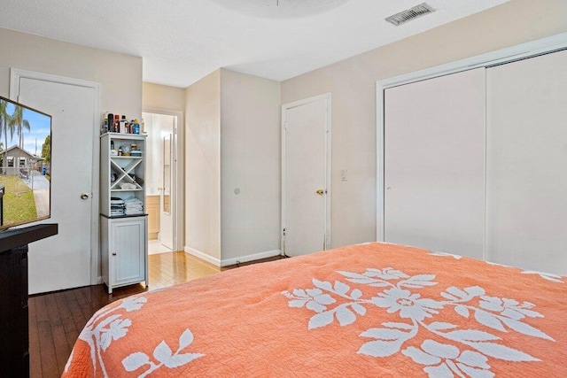 bedroom featuring wood-type flooring