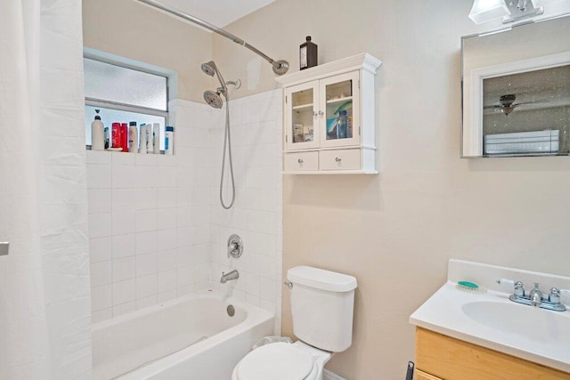 full bathroom with shower / tub combo with curtain, vanity, and toilet