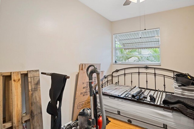 bedroom with ceiling fan and wood-type flooring