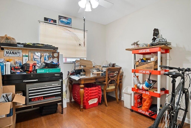 interior space with hardwood / wood-style floors and ceiling fan