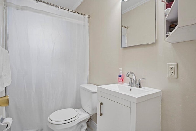 bathroom featuring ornamental molding, toilet, and vanity