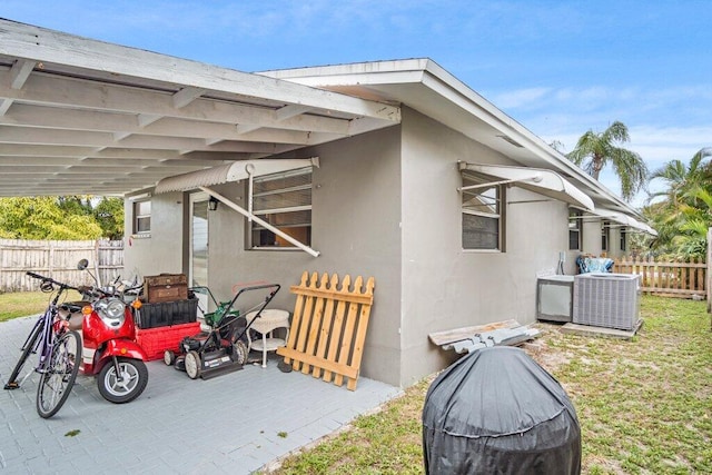 view of side of home with cooling unit