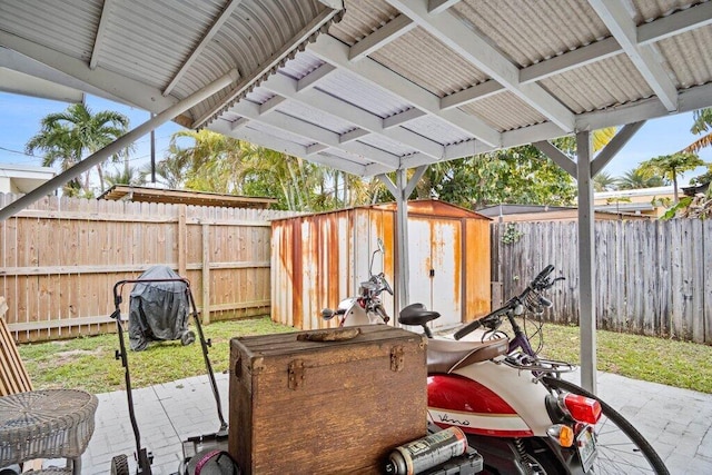 view of patio with a storage shed