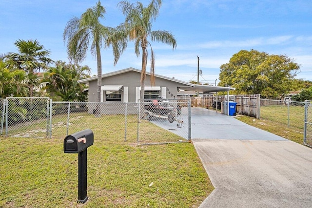 view of front of house with a carport and a front lawn