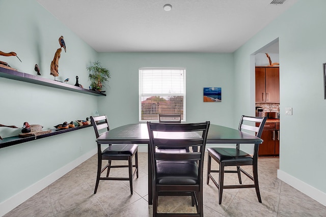 view of tiled dining space