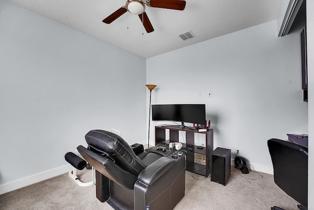 home office featuring light colored carpet and ceiling fan