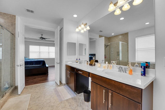 bathroom with vanity, tile patterned floors, ceiling fan, and walk in shower