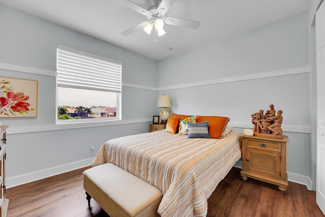 bedroom featuring dark wood-type flooring and ceiling fan