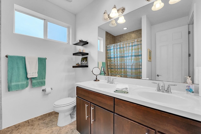 bathroom with vanity, curtained shower, tile patterned floors, and toilet