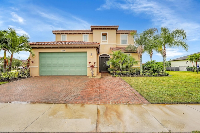 mediterranean / spanish-style home with a front lawn