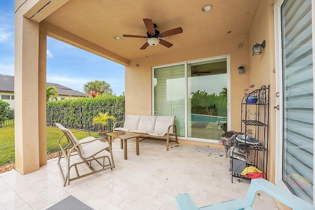 view of patio featuring ceiling fan