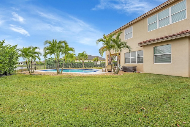 view of yard with a fenced in pool and central air condition unit