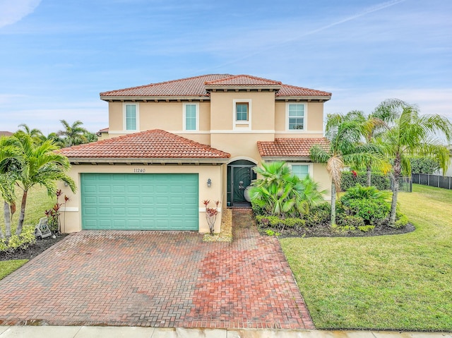 mediterranean / spanish house with a front lawn