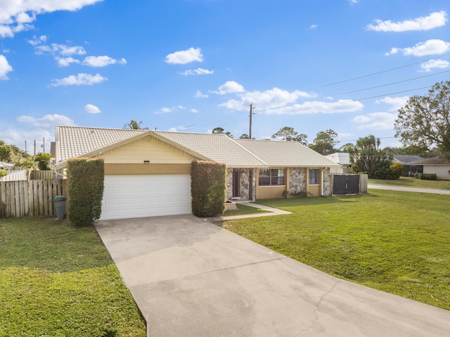 single story home featuring a garage and a front yard