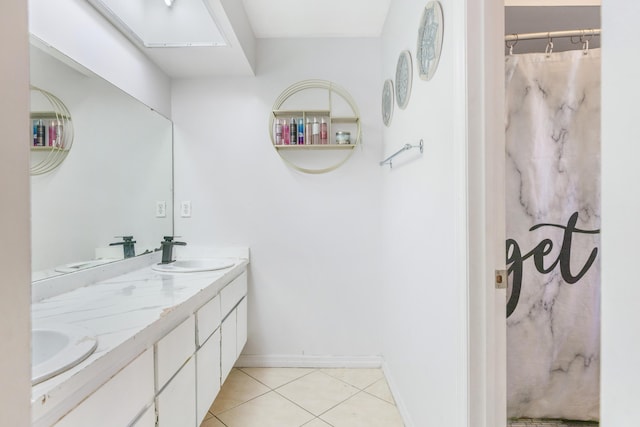 bathroom featuring a shower with curtain, vanity, and tile patterned flooring