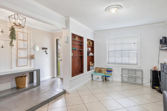 interior space featuring ornamental molding, a chandelier, light tile patterned floors, and a textured ceiling