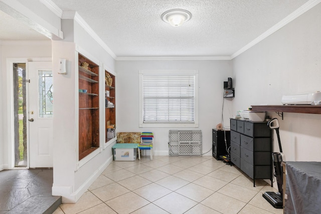 misc room featuring crown molding, light tile patterned flooring, and a textured ceiling