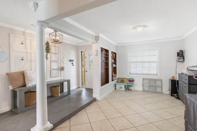 mudroom featuring baseboards, ornate columns, ornamental molding, and a textured ceiling