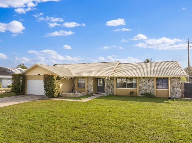 single story home with a garage and a front lawn