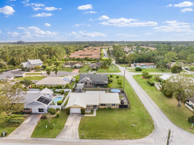 aerial view featuring a residential view and a view of trees