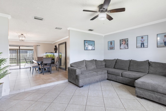 tiled living room with crown molding, ceiling fan, and a textured ceiling