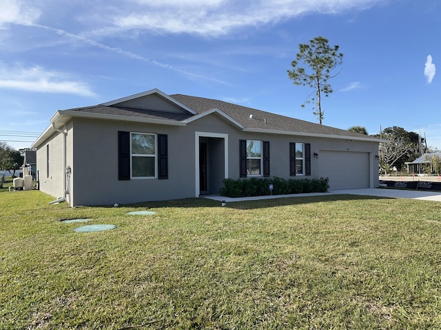 ranch-style home featuring a garage and a front yard