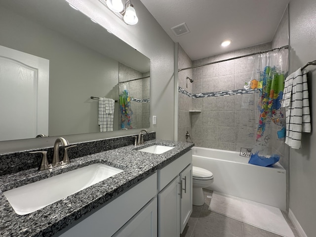 full bathroom featuring vanity, tile patterned flooring, toilet, and shower / bath combo