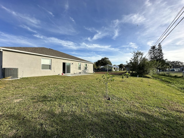 view of yard with central air condition unit