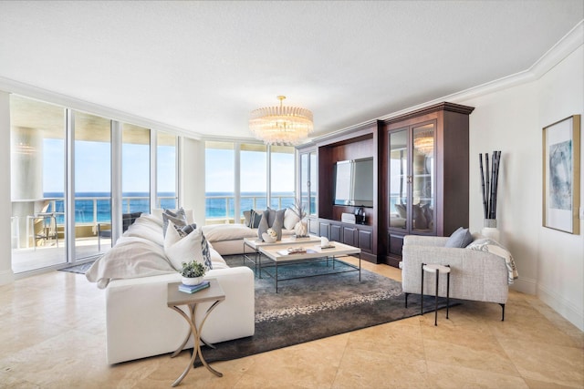 living room featuring a water view, an inviting chandelier, plenty of natural light, and floor to ceiling windows