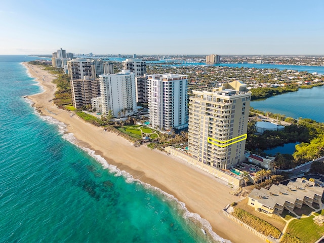 drone / aerial view featuring a view of the beach and a water view