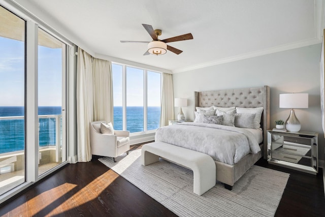 bedroom featuring dark wood-style floors, a water view, crown molding, and ceiling fan