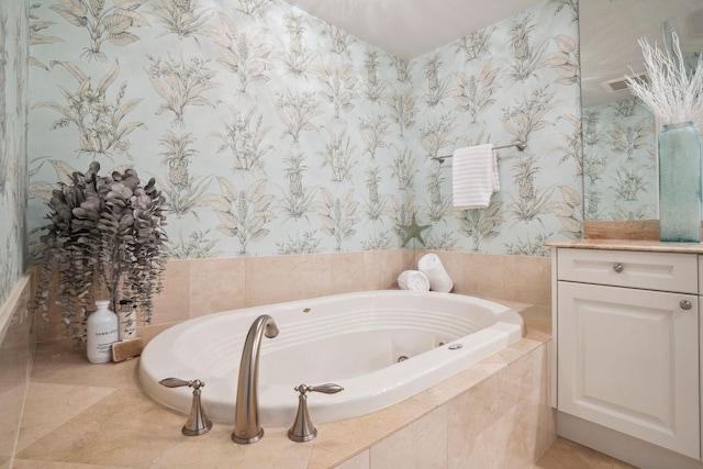 full bathroom featuring a jetted tub, wallpapered walls, visible vents, and vanity