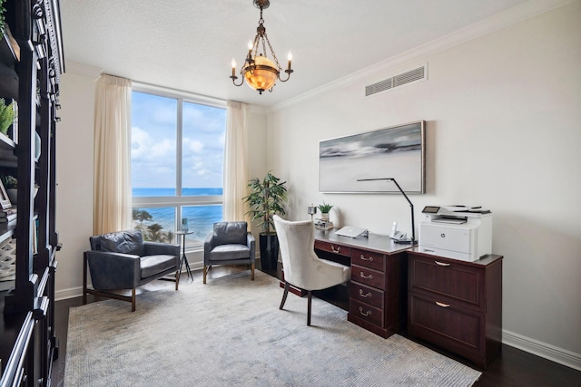 office with a water view, visible vents, ornamental molding, a chandelier, and baseboards