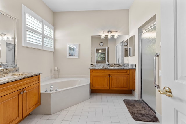 bathroom with vanity, tile patterned flooring, and separate shower and tub