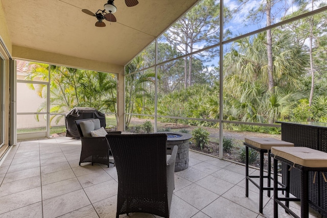 sunroom / solarium with ceiling fan and plenty of natural light