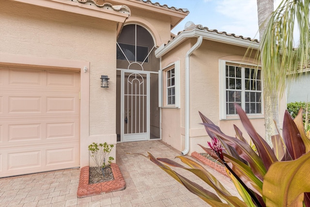 entrance to property featuring a garage