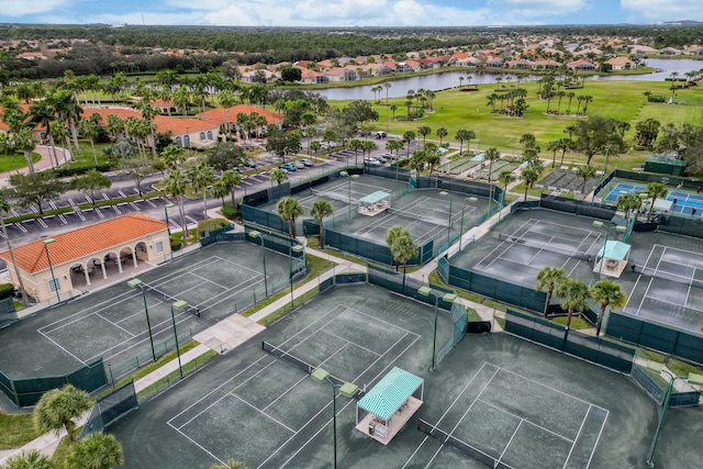 bird's eye view with a water view