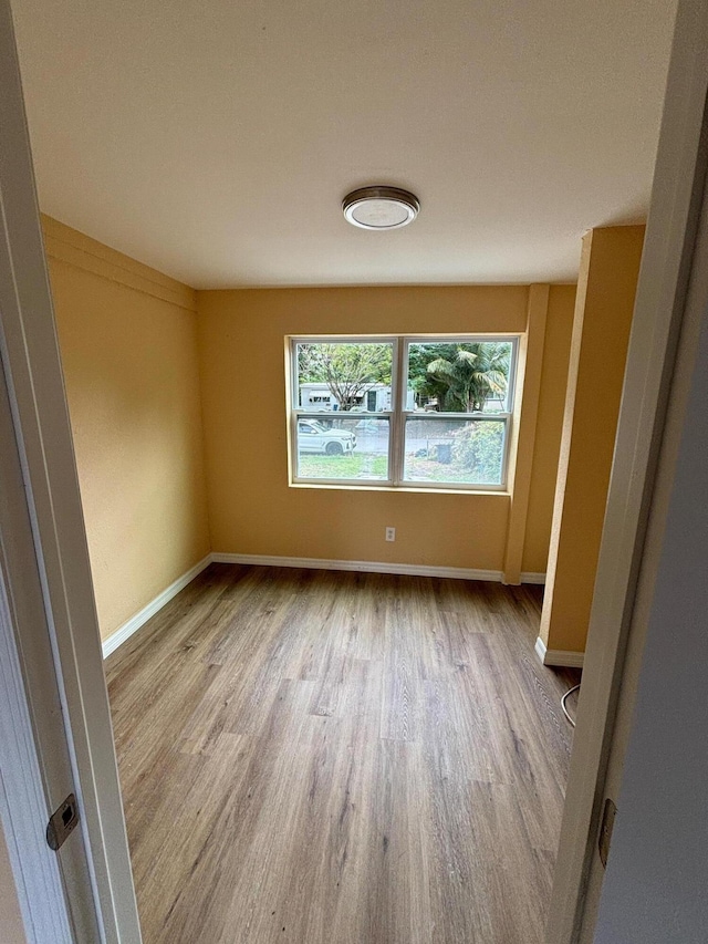 empty room with light hardwood / wood-style floors