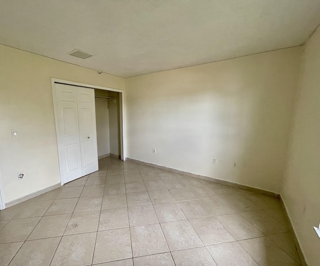 unfurnished bedroom featuring light tile patterned floors