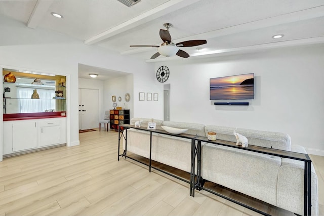 living room with ceiling fan, beam ceiling, and light hardwood / wood-style floors