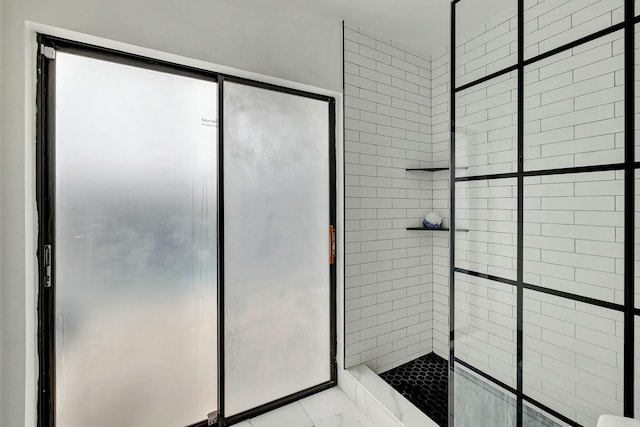 bathroom with a tile shower