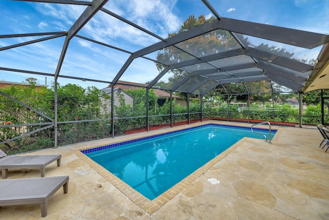 view of swimming pool featuring a lanai and a patio