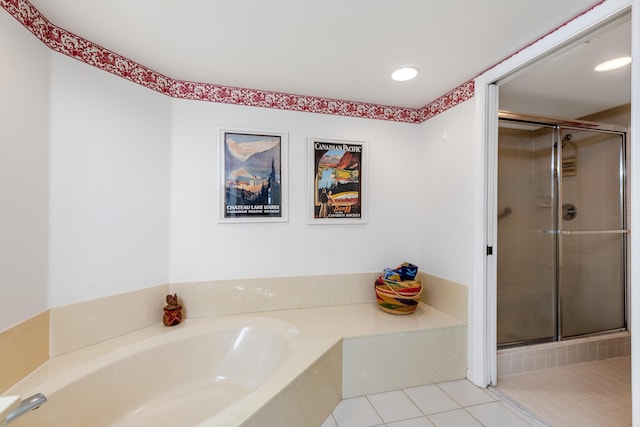 bathroom with independent shower and bath and tile patterned floors