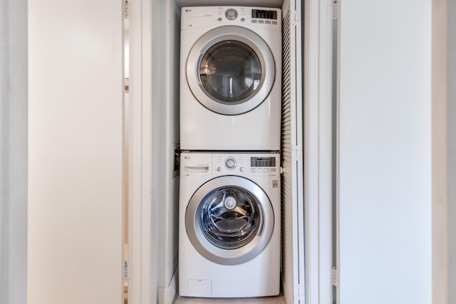 laundry area featuring stacked washer and clothes dryer