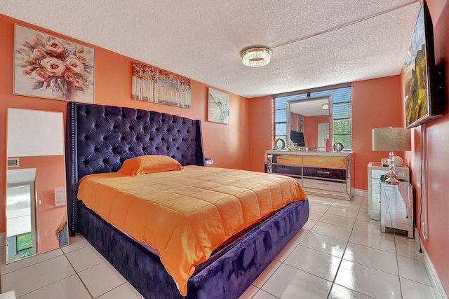 tiled bedroom with a textured ceiling