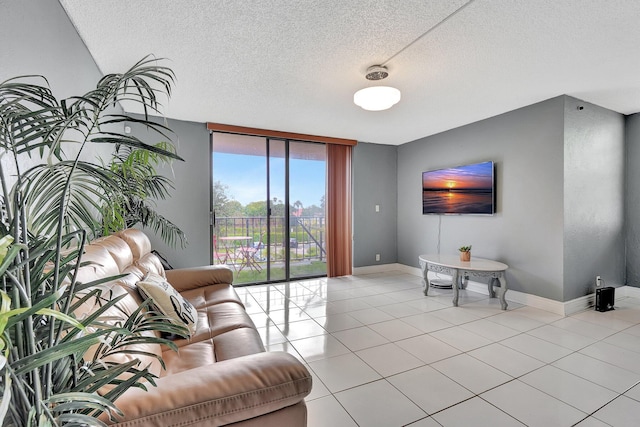 tiled living room with expansive windows and a textured ceiling