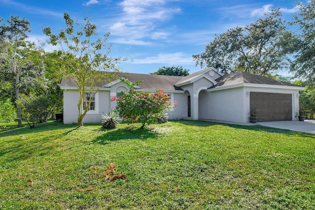 single story home featuring an attached garage, driveway, a front lawn, and stucco siding