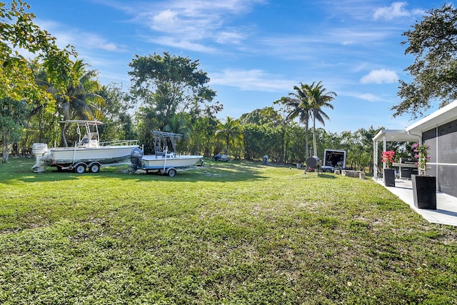 view of yard featuring a sunroom