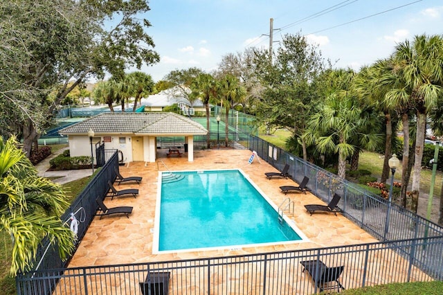 view of swimming pool with a patio area